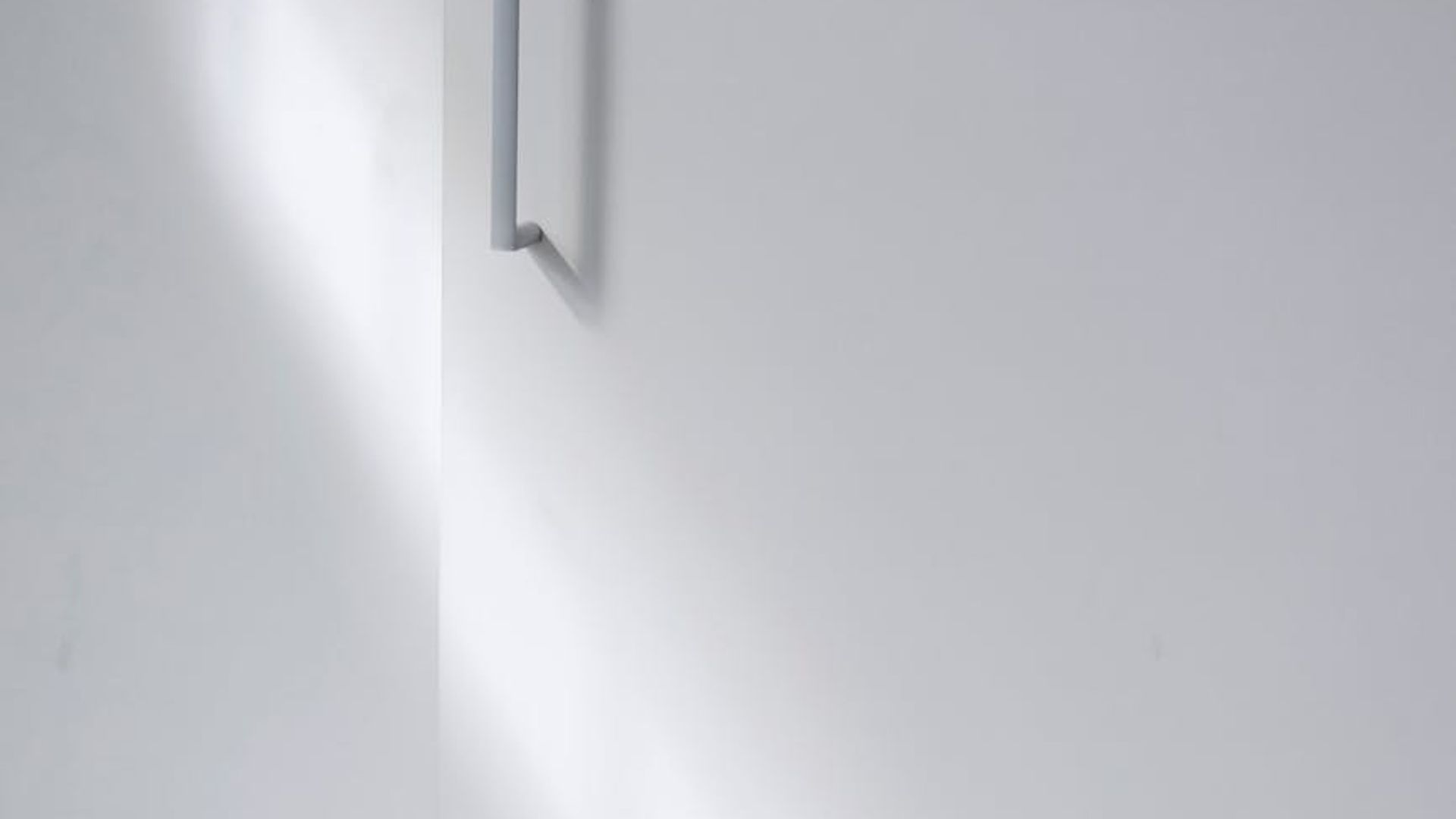 Abstract background image with subtle geometric patterns suggesting structure and calm.