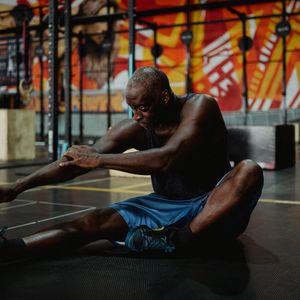 Man stretching after a workout, focusing on recovery and flexibility.